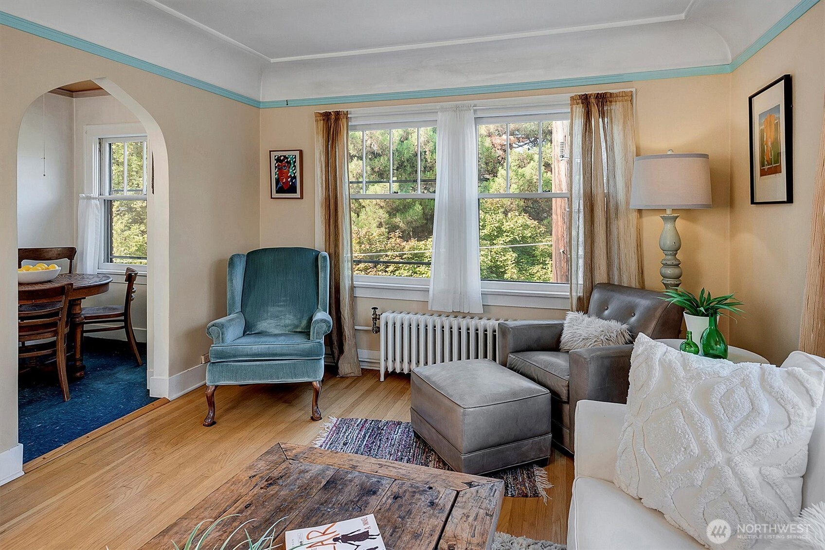 1605 East Olive Street, Unit 303 Seattle, WA 98122 - Photo 12 of 36 a living room with furniture and a window