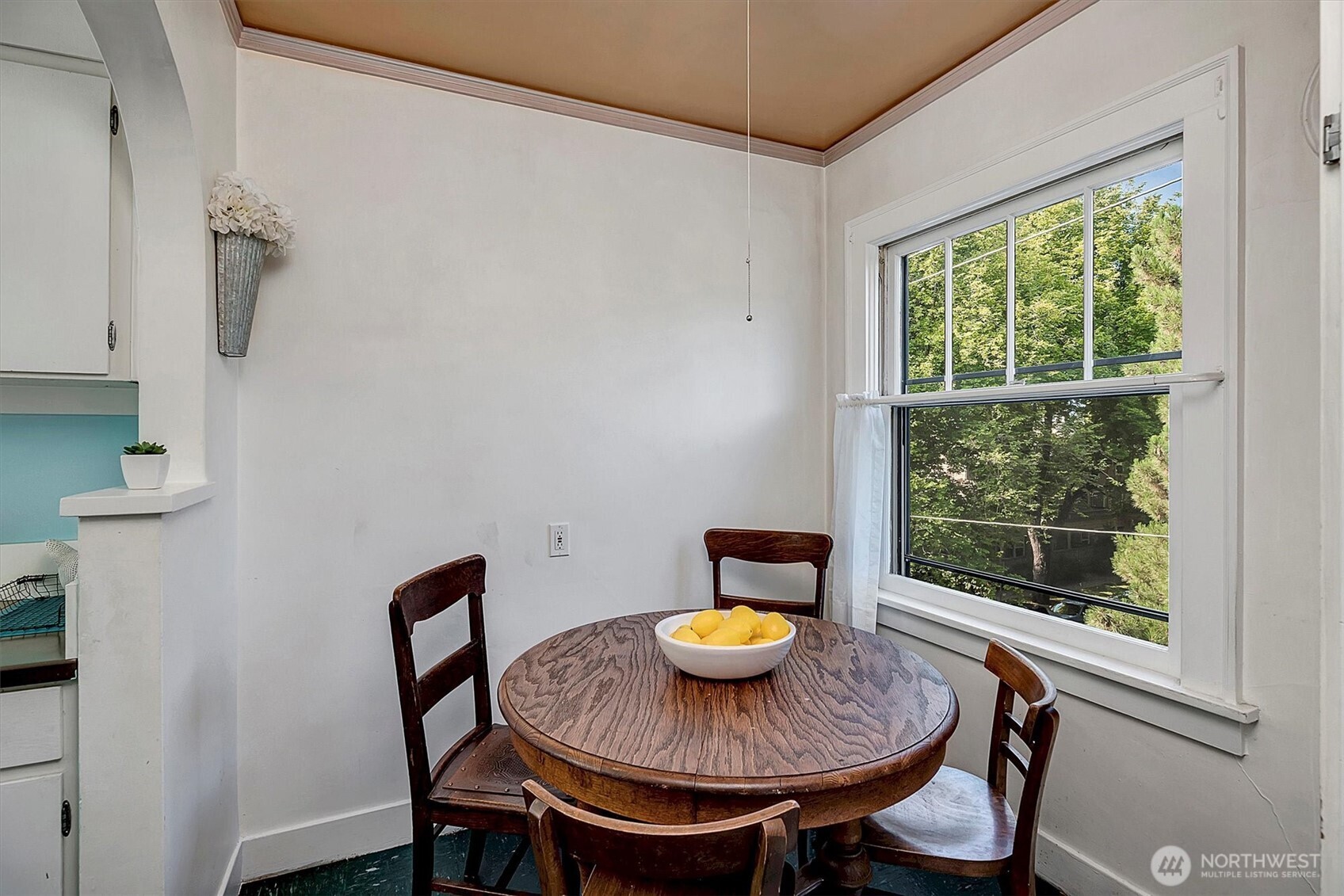 1605 East Olive Street, Unit 303 Seattle, WA 98122 - Photo 13 of 36 a view of a dining room with furniture window and outside view