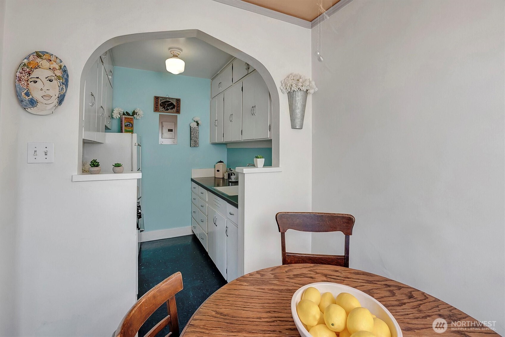 1605 East Olive Street, Unit 303 Seattle, WA 98122 - Photo 14 of 36 a bedroom with a bed and a chair