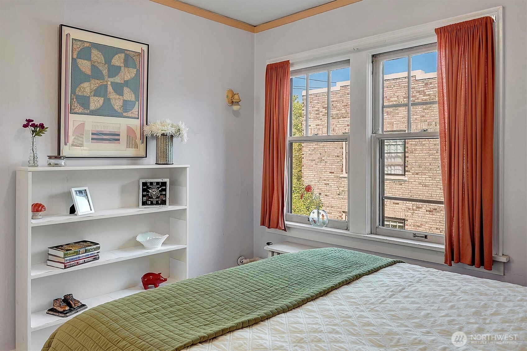 1605 East Olive Street, Unit 303 Seattle, WA 98122 - Photo 20 of 36 a bedroom with a bed and a window