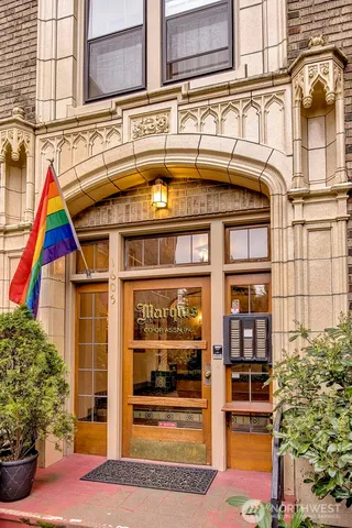 a living room with furniture and a mirror