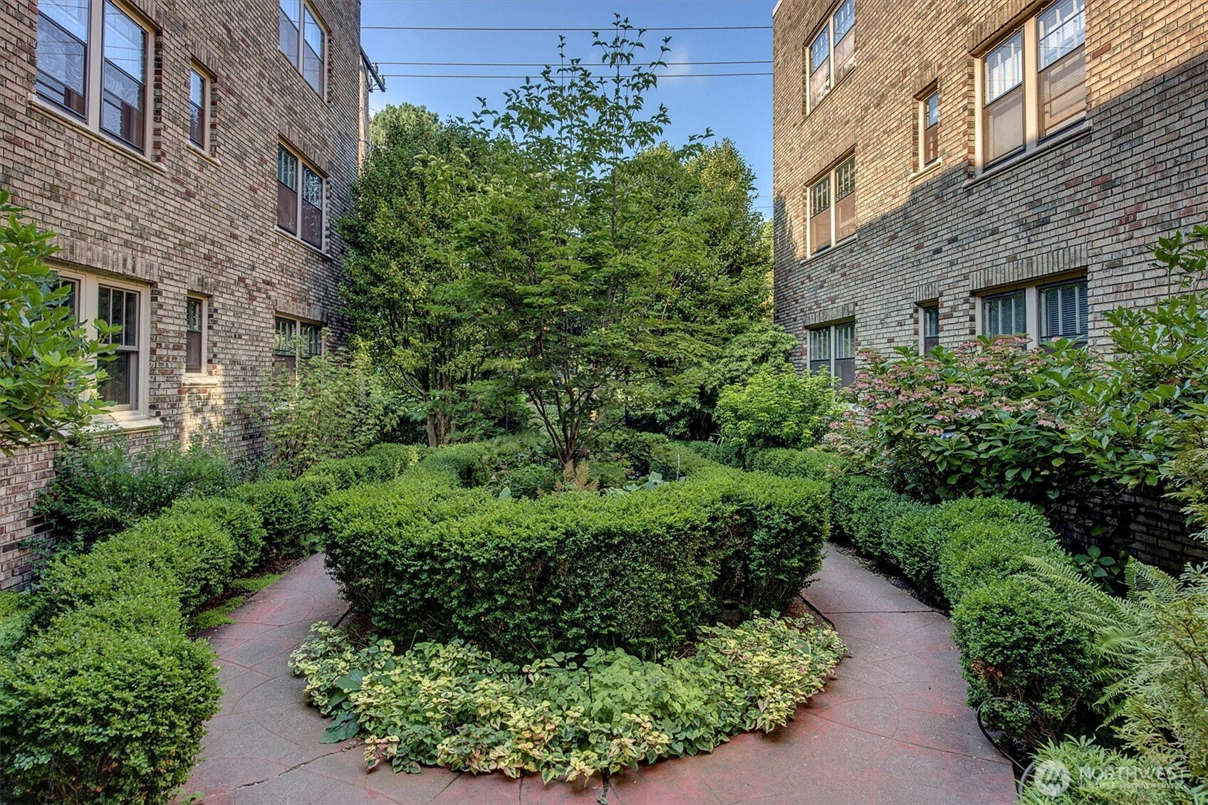 1605 East Olive Street, Unit 303 Seattle, WA 98122 - Photo 31 of 36 a view of a pathway both side of house