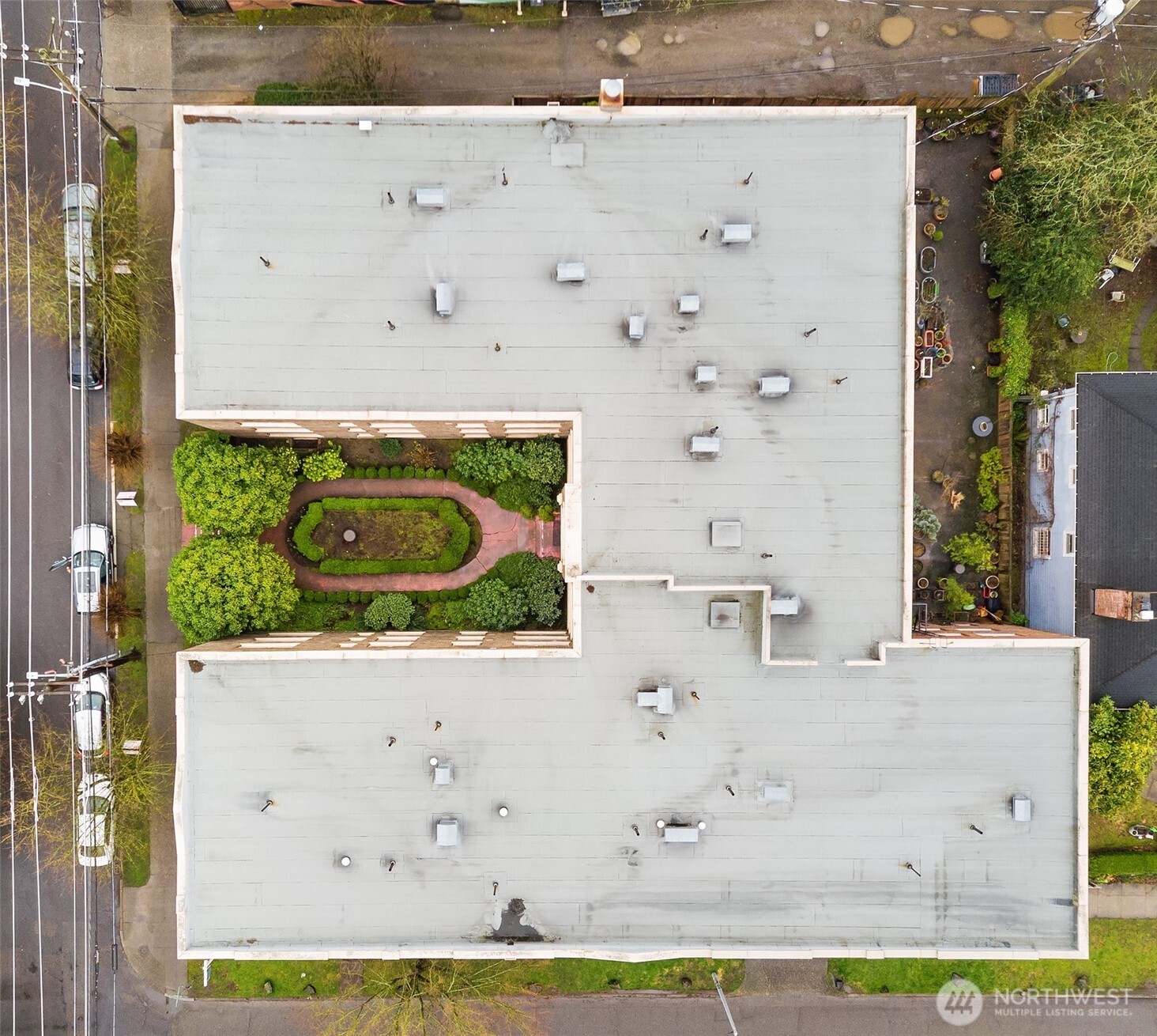 1605 East Olive Street, Unit 303 Seattle, WA 98122 - Photo 36 of 36 an aerial view of a house with a yard