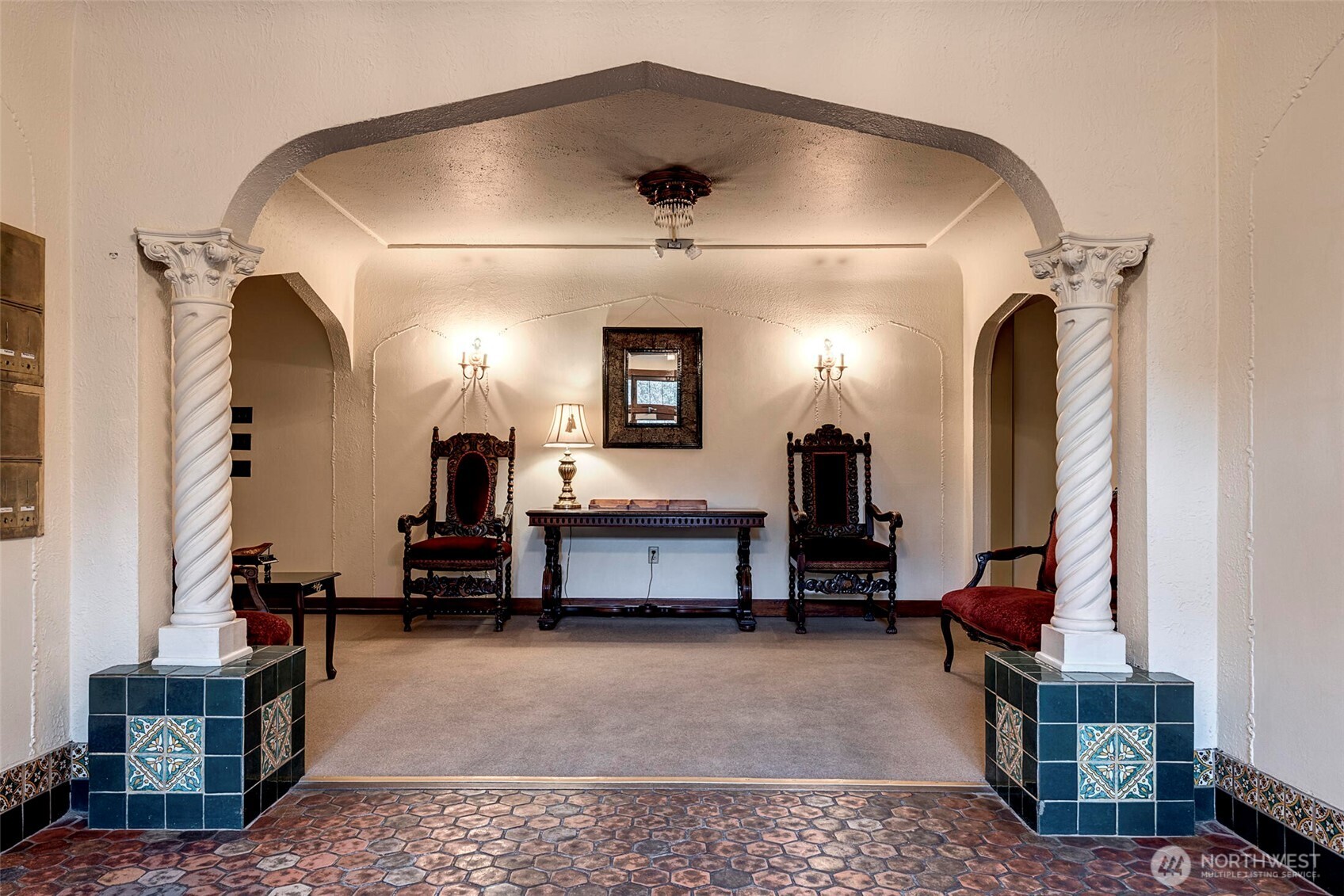 1605 East Olive Street, Unit 303 Seattle, WA 98122 - Photo 4 of 36 a living room with furniture and a mirror