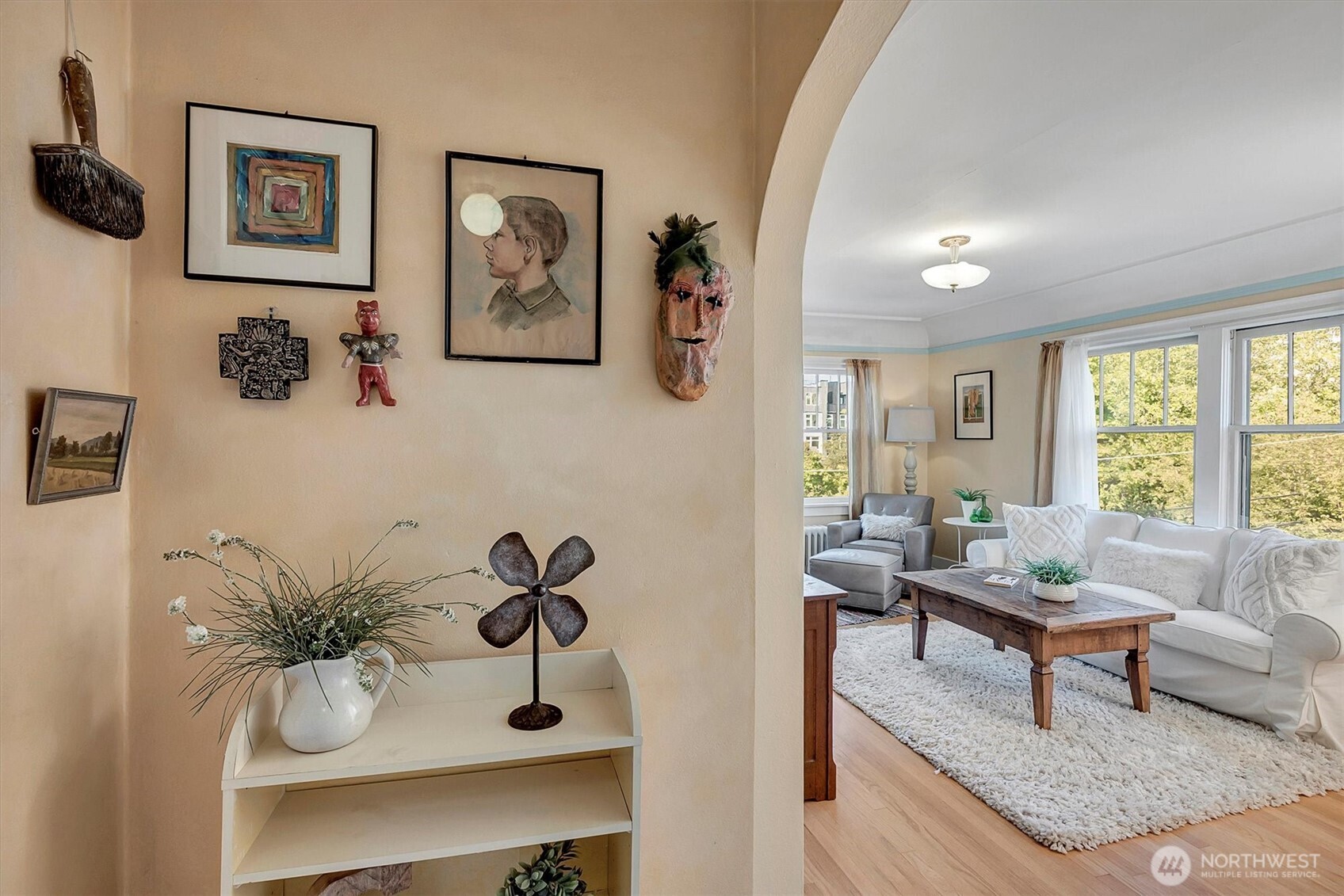 1605 East Olive Street, Unit 303 Seattle, WA 98122 - Photo 6 of 36 a living room with furniture and a large window