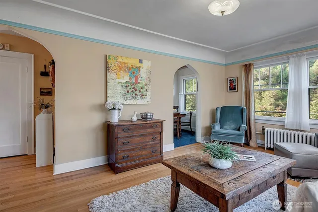 a bedroom with furniture and a potted plant