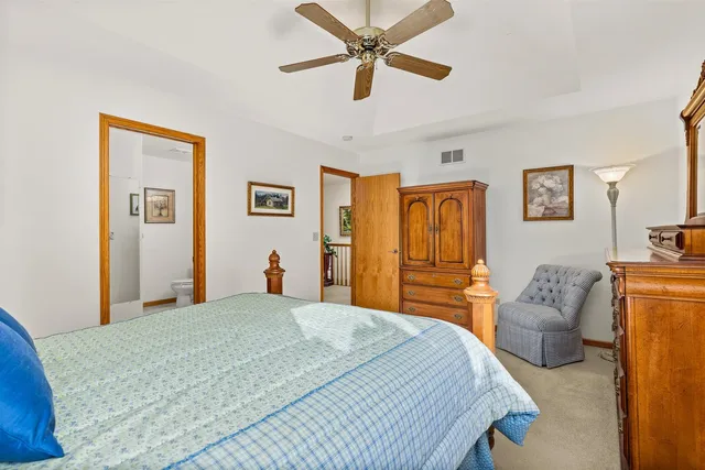 a bedroom with a bed and dresser