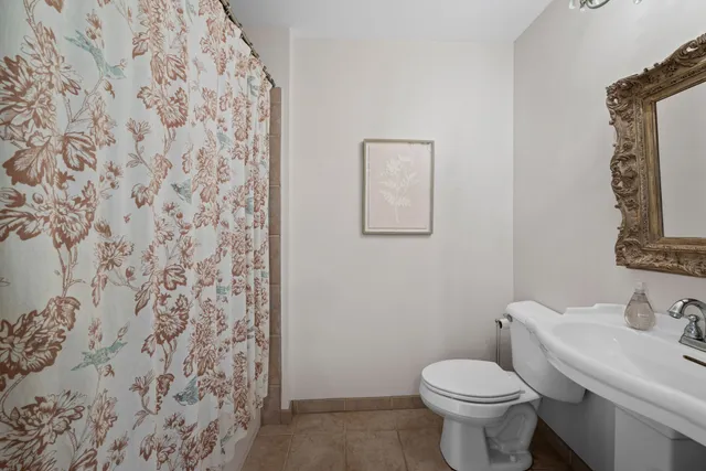 a bathroom with a toilet and a sink