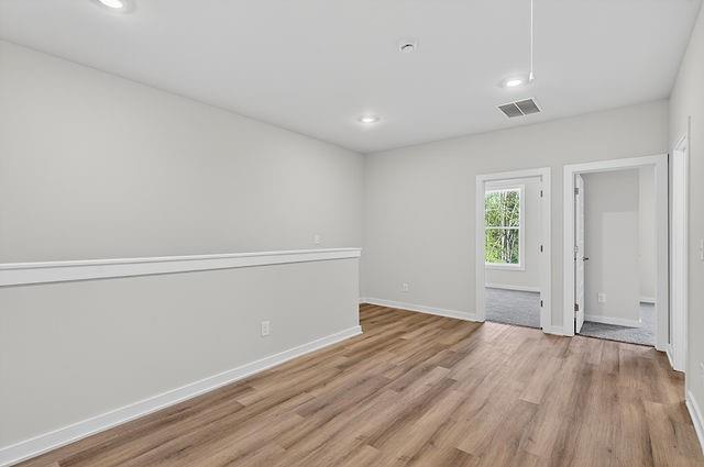 2562 Harbor Ridge Pass Gainesville, GA 30507 - Photo 13 of 27 wooden floor in an empty room with a window