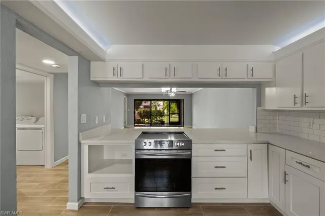 a stove top oven sitting inside of a kitchen