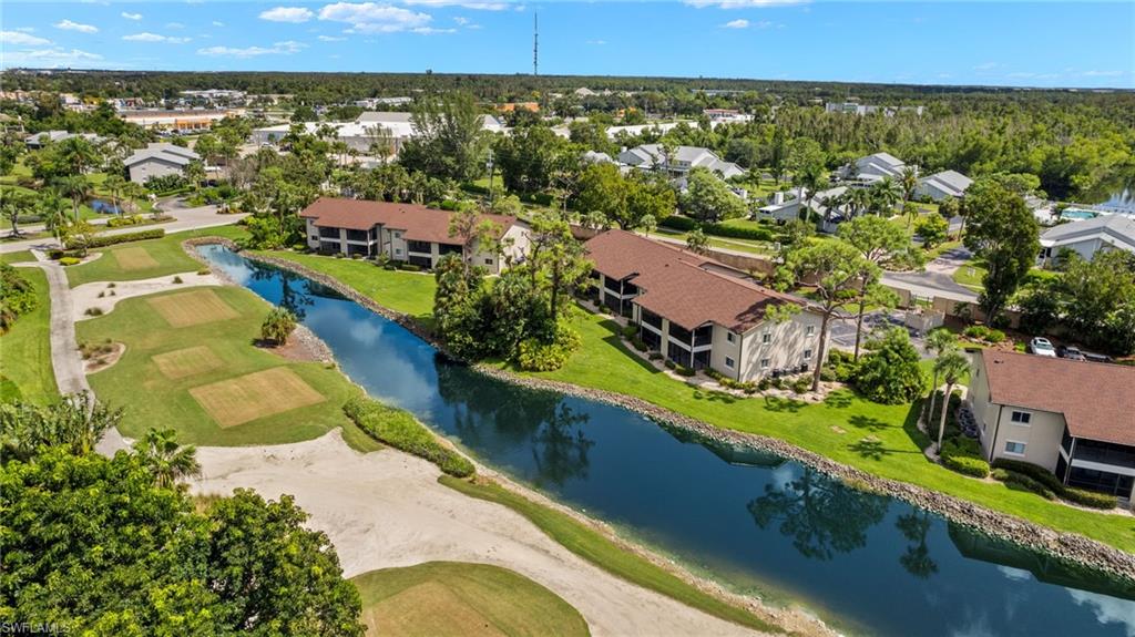 16540 Partridge Club Road, Unit 103 Fort Myers, FL 33908 - Photo 30 of 36 an aerial view of residential houses with outdoor space