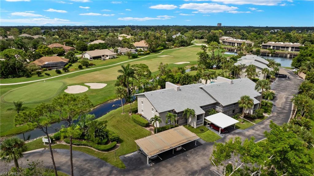 16540 Partridge Club Road, Unit 103 Fort Myers, FL 33908 - Photo 33 of 36 an aerial view of a city with lots of residential buildings