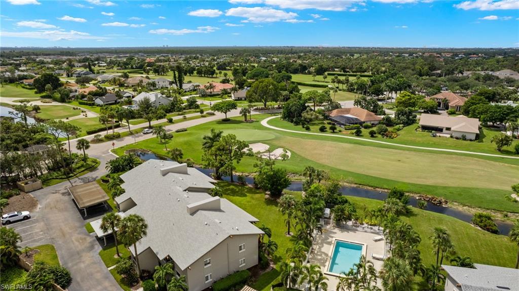 16540 Partridge Club Road, Unit 103 Fort Myers, FL 33908 - Photo 34 of 36 an aerial view of residential houses with outdoor space