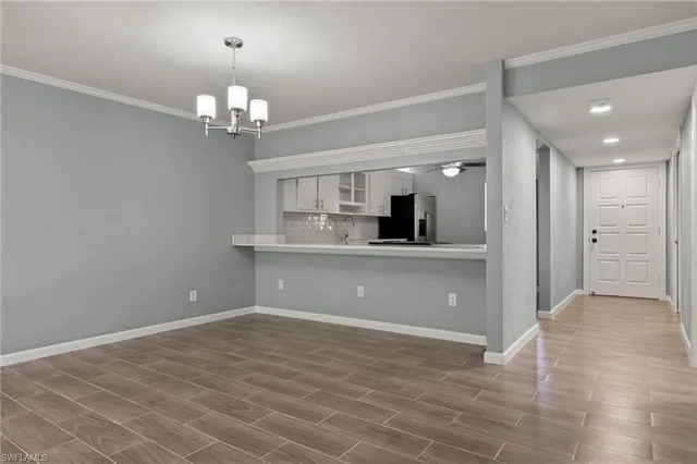 a view of a kitchen with an empty space and a kitchen