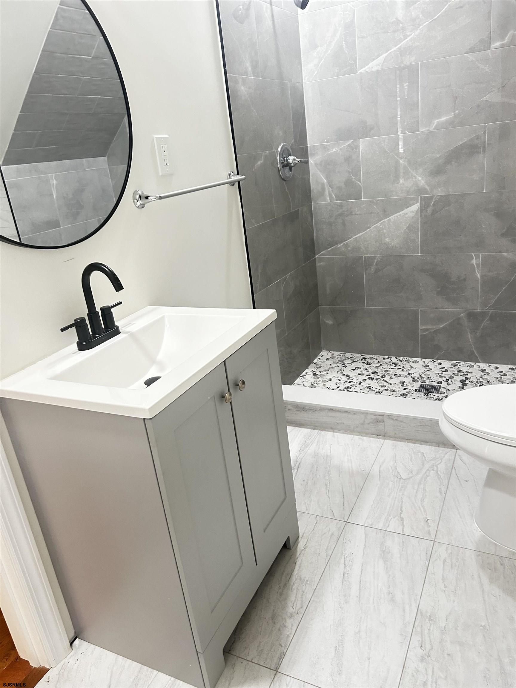 715 Ramah Road Millville, NJ 08332 - Photo 11 of 42 a bathroom with a sink and a mirror