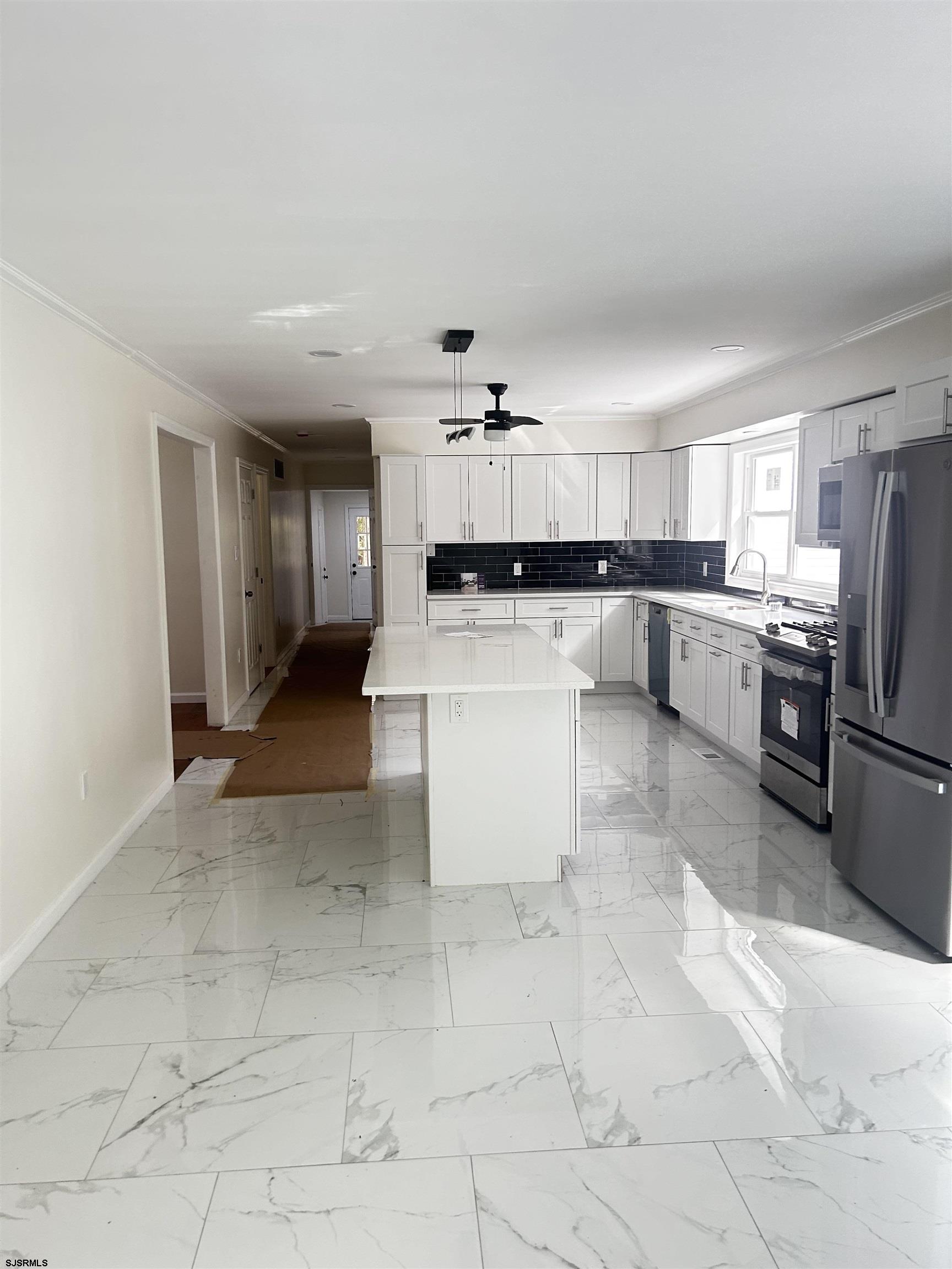 715 Ramah Road Millville, NJ 08332 - Photo 3 of 42 a large kitchen with cabinets and stainless steel appliances