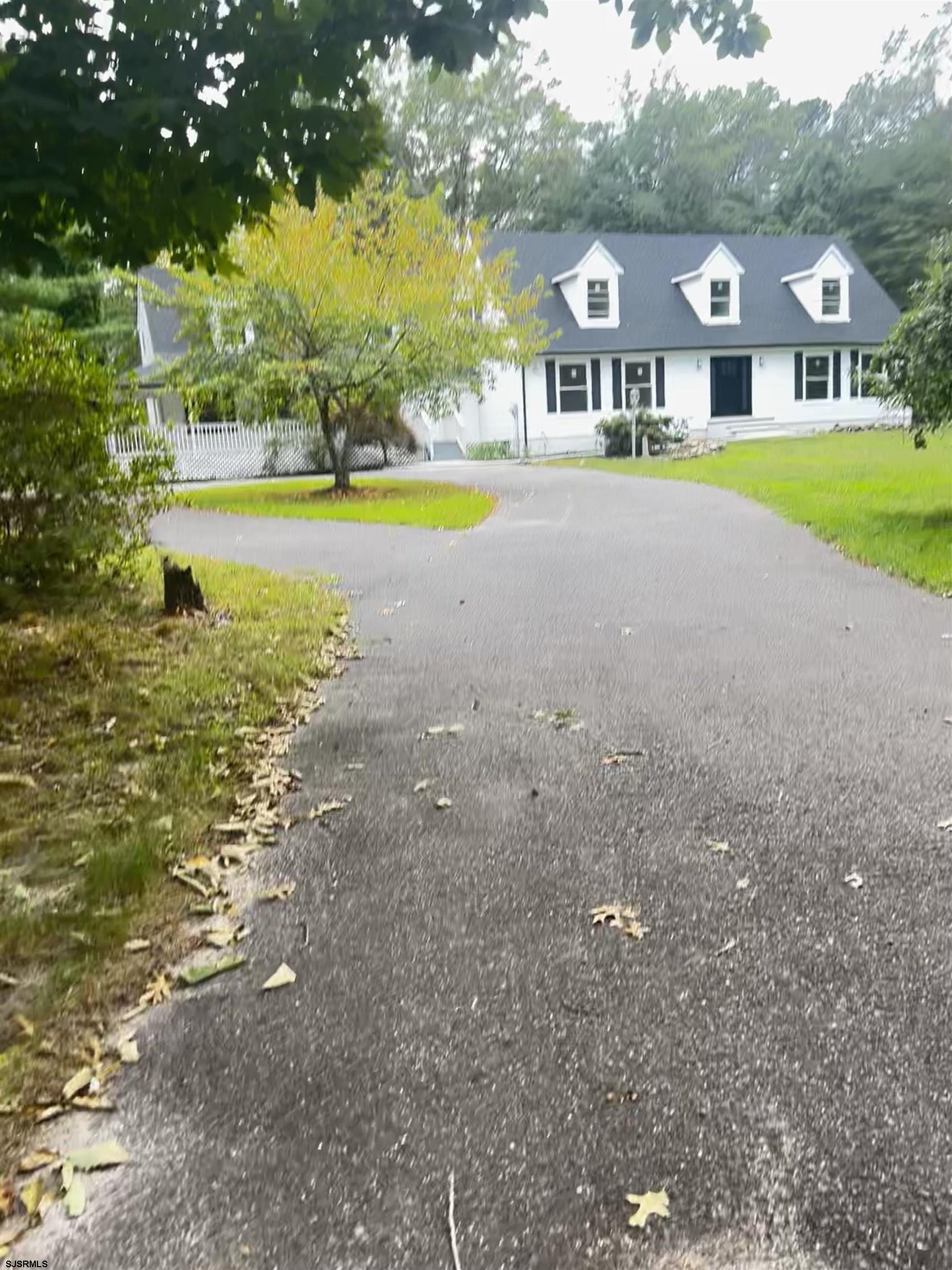 715 Ramah Road Millville, NJ 08332 - Photo 39 of 42 a front view of a house with a big yard and large trees