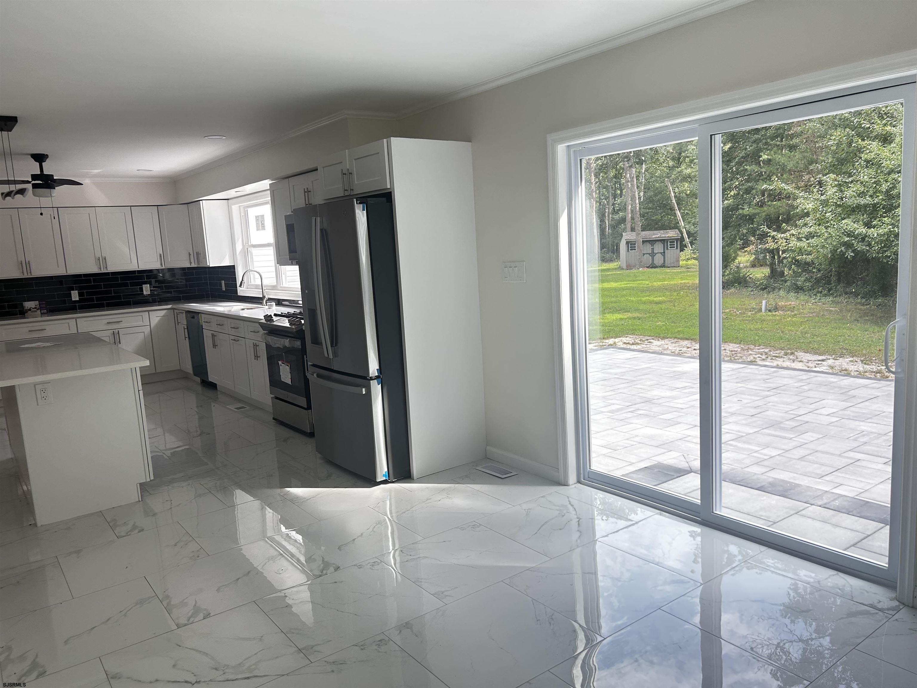 715 Ramah Road Millville, NJ 08332 - Photo 7 of 42 a kitchen with a refrigerator and a view of living room