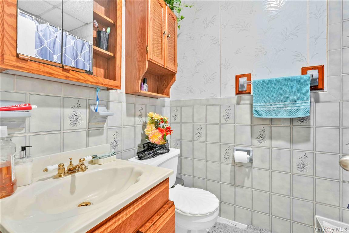 104-21 92nd Avenue Queens, NY 11418 - Photo 19 of 48 a bathroom with a sink toilet and shower