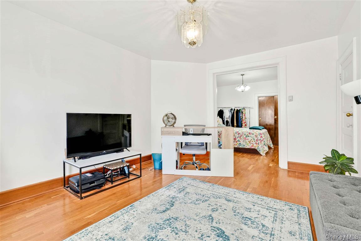 104-21 92nd Avenue Queens, NY 11418 - Photo 20 of 48 a living room with furniture and a flat screen tv