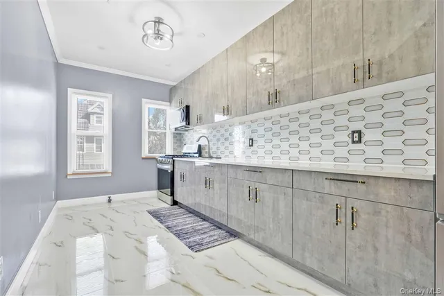 a kitchen with stainless steel appliances granite countertop a stove and a sink
