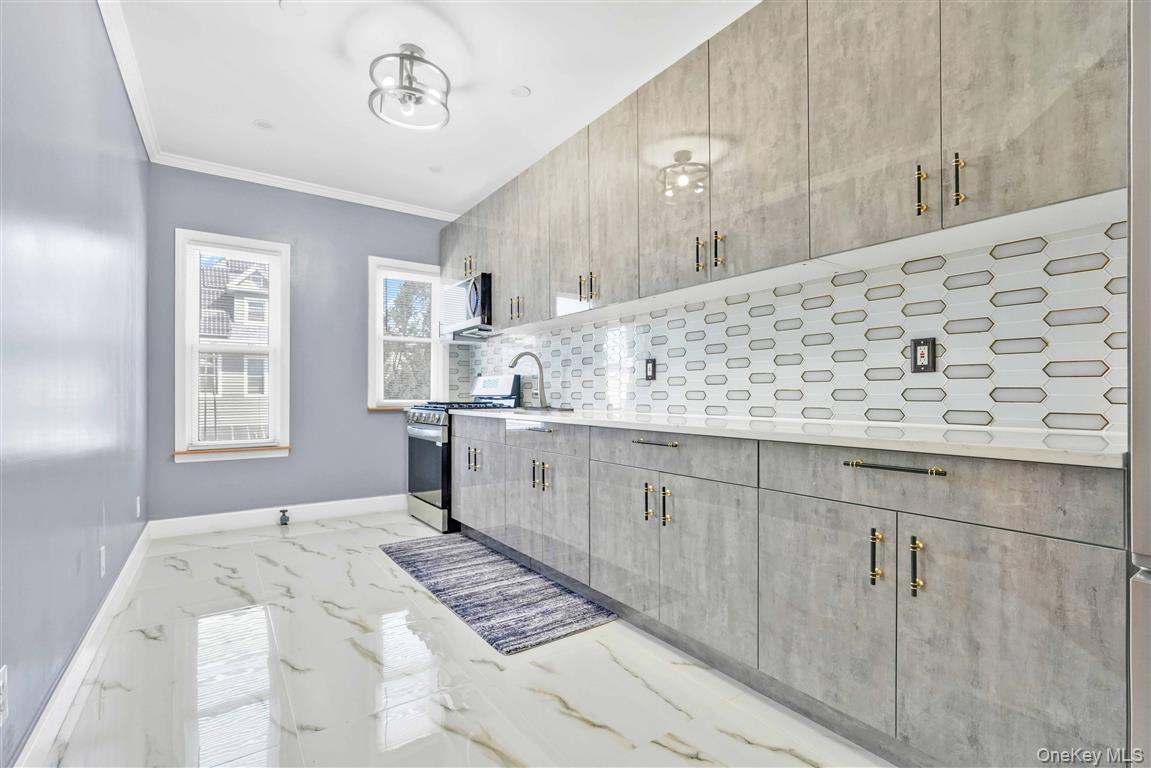 104-21 92nd Avenue Queens, NY 11418 - Photo 22 of 48 a bathroom with a sink a vanity and a mirror