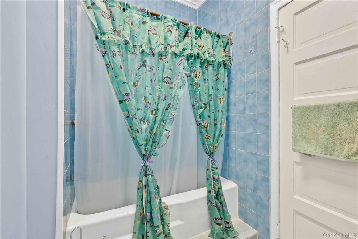 104-21 92nd Avenue Queens, NY 11418 - Photo 25 of 48 a close view of a shower curtain