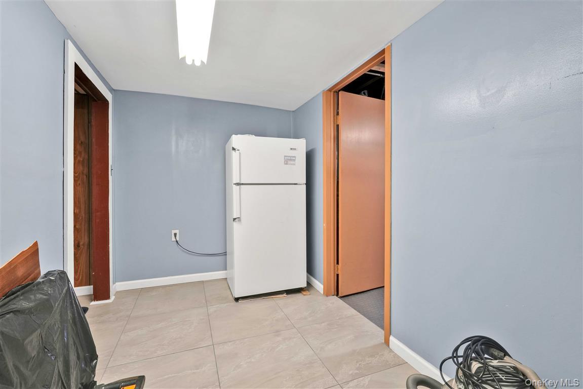 104-21 92nd Avenue Queens, NY 11418 - Photo 29 of 48 a view of a storage & utility room with washer and dryer