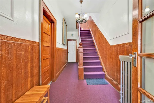 a view of staircase with wooden floor and stairs