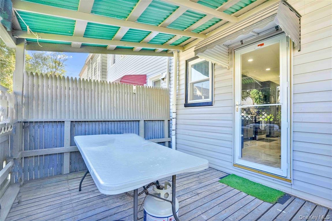 104-21 92nd Avenue Queens, NY 11418 - Photo 34 of 48 a view of a deck with wooden floor