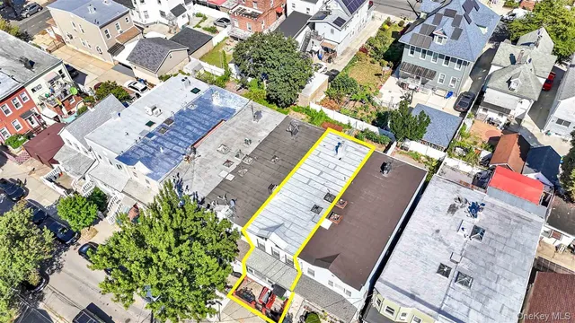 an aerial view of houses with outdoor space