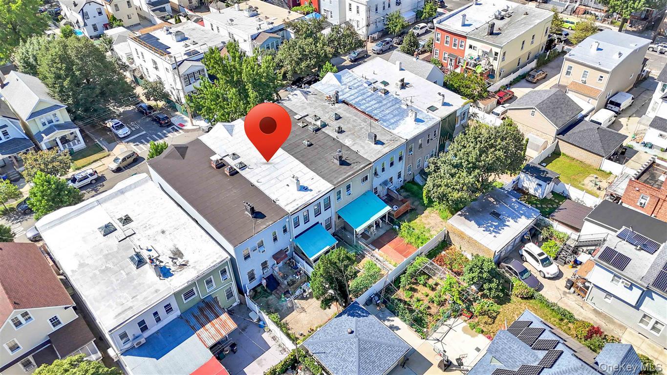 104-21 92nd Avenue Queens, NY 11418 - Photo 43 of 48 an aerial view of a residential apartment building with a yard and a lot of stuff
