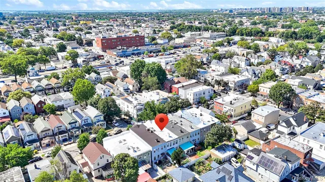 an aerial view of residential houses with outdoor space
