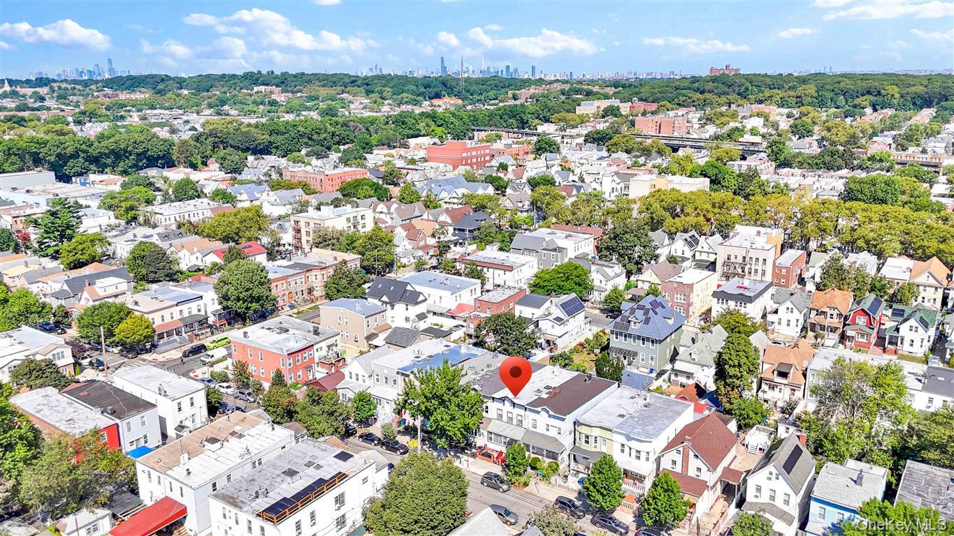 104-21 92nd Avenue Queens, NY 11418 - Photo 46 of 48 an aerial view of residential houses with outdoor space and trees all around