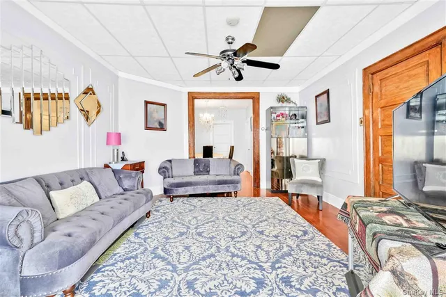 a bedroom with furniture and a large window