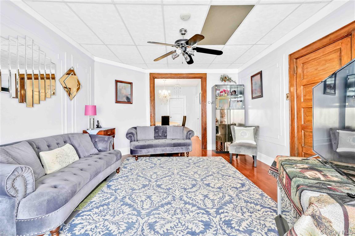 104-21 92nd Avenue Queens, NY 11418 - Photo 6 of 48 a bedroom with furniture and a large window