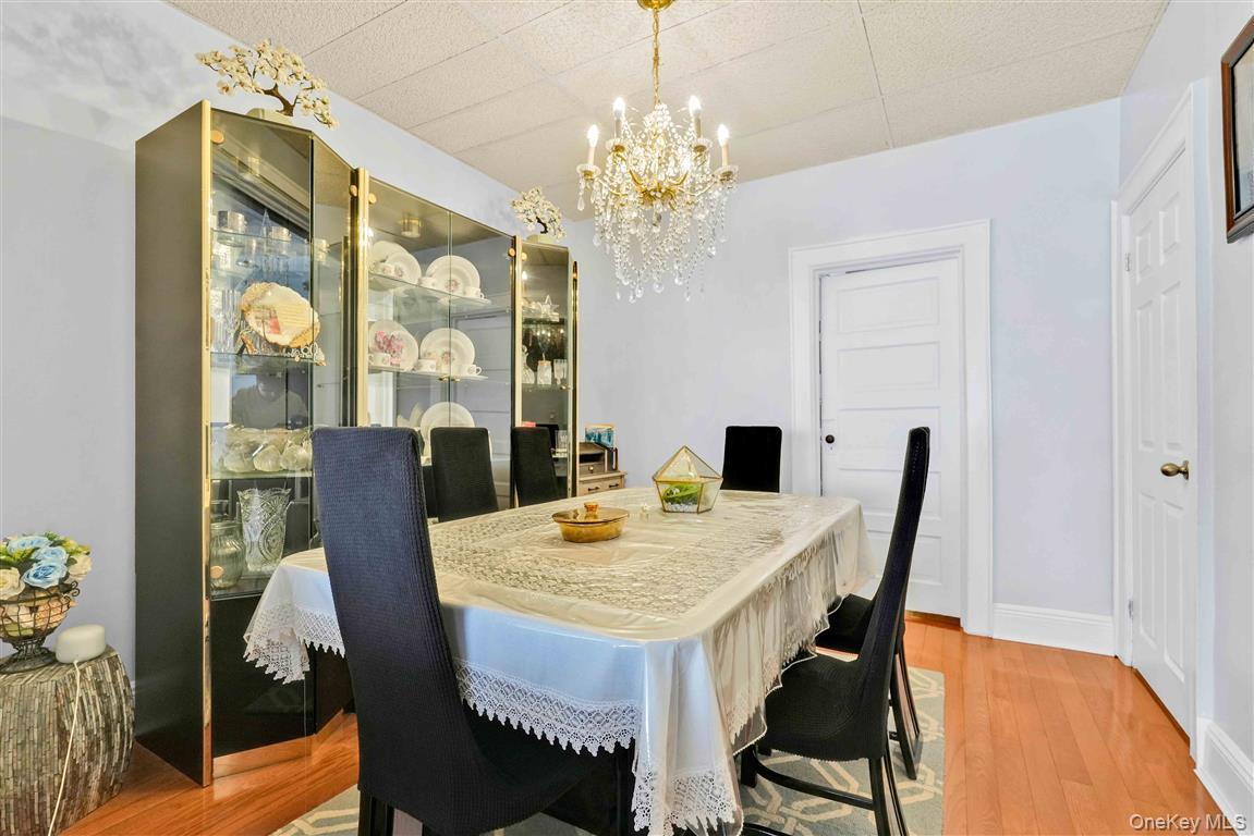 104-21 92nd Avenue Queens, NY 11418 - Photo 8 of 48 a view of a dining room with furniture and a chandelier