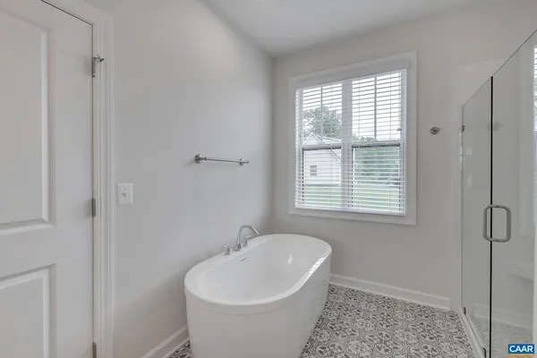 a bathroom with a toilet a sink and shower
