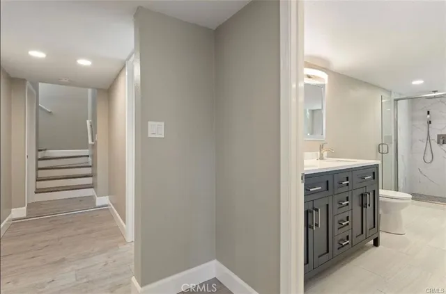 a bathroom with a double vanity sink and a mirror