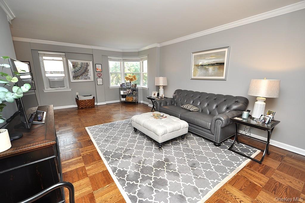 235 Garth Road, Unit E2E Scarsdale, NY 10583 - Photo 2 of 46 The large living room has refinished parquet floors, a bay window and opens to both the dining room and foyer. The living room is approx 21'-5' x 12'-6" .
