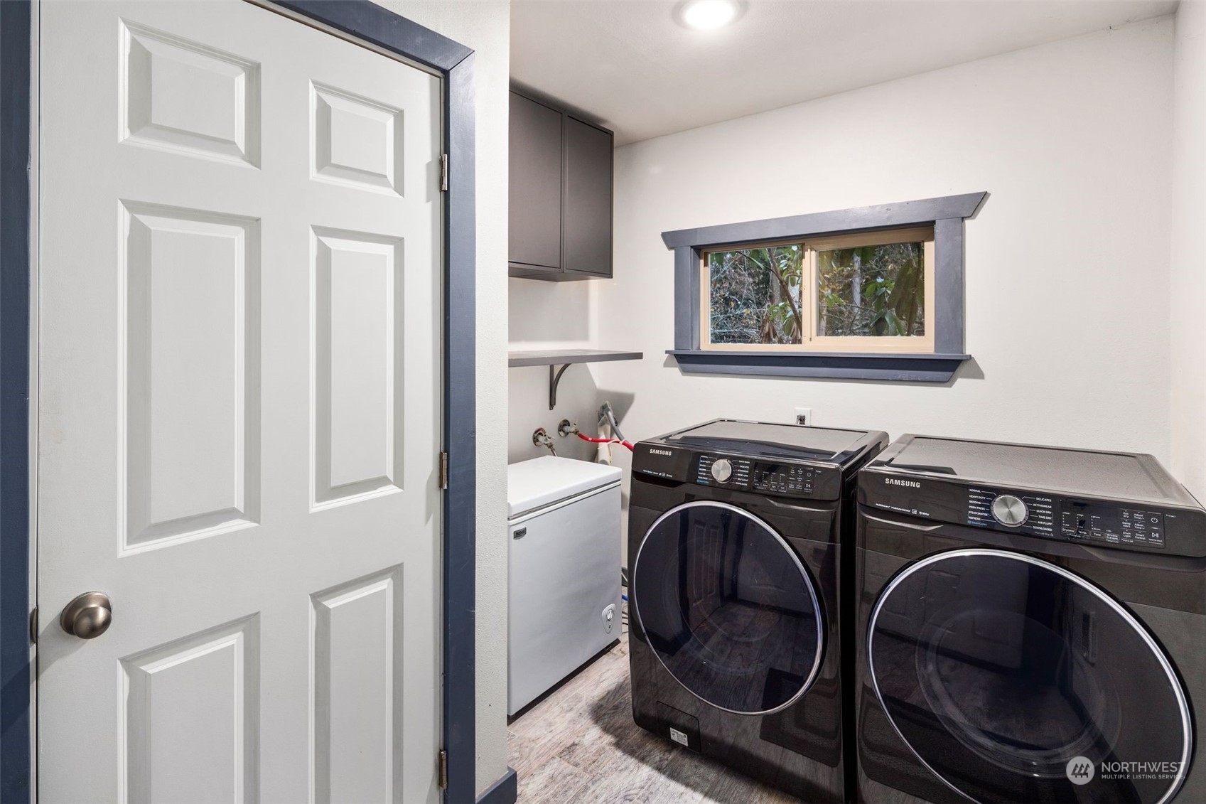 18337 Southeast May Valley Road Issaquah, WA 98027 - Photo 27 of 40 a view of a storage and utility room with washer and dryer