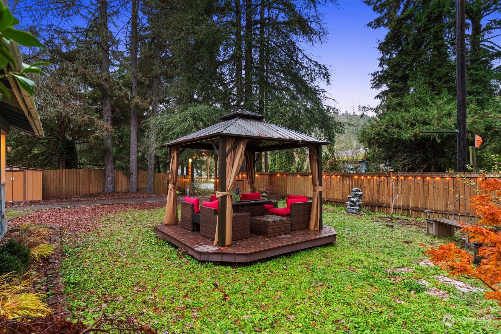 18337 Southeast May Valley Road Issaquah, WA 98027 - Photo 33 of 40 a view of a garden with a slide and large trees