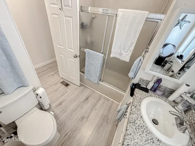 a bathroom with a sink and toilet