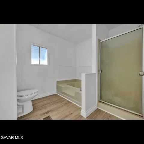 a view of cabinets with wooden floor