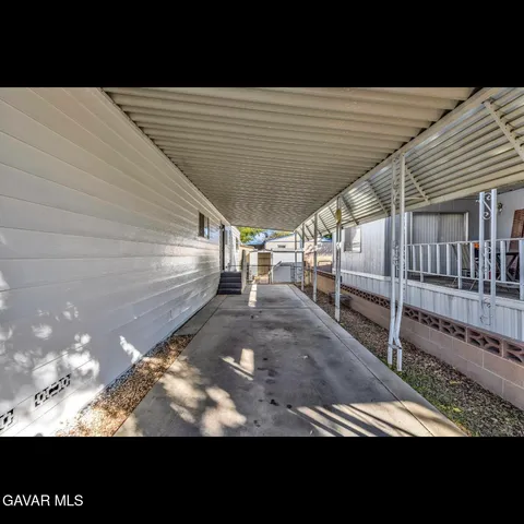a view of roof deck with patio