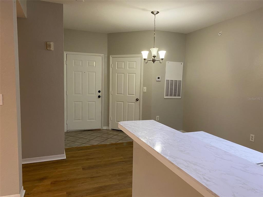 5447 Vineland Road, Unit 1303 Orlando, FL 32811 - Photo 4 of 18 a view of a chandelier in a room