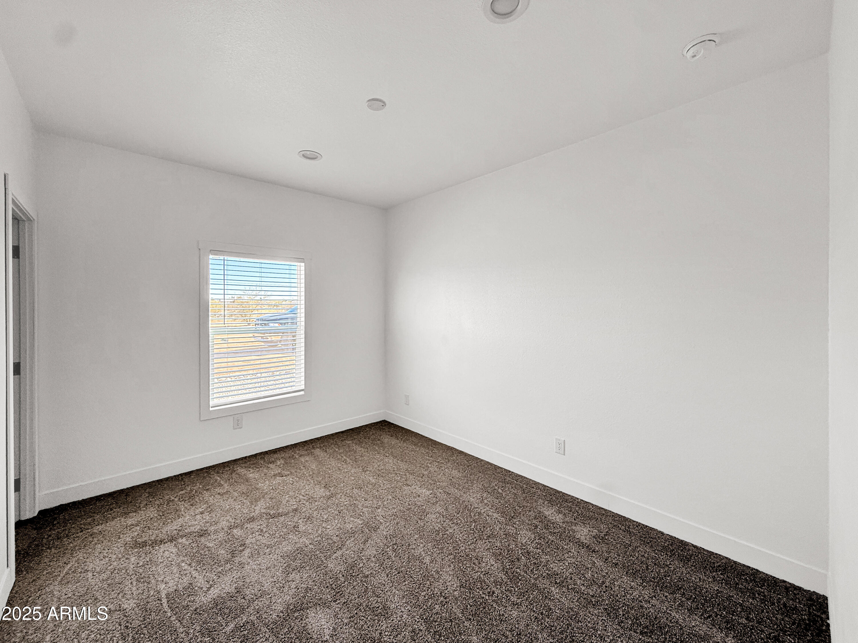 8548 North Page Road Florence, AZ 85132 - Photo 15 of 23 a view of an empty room with a window