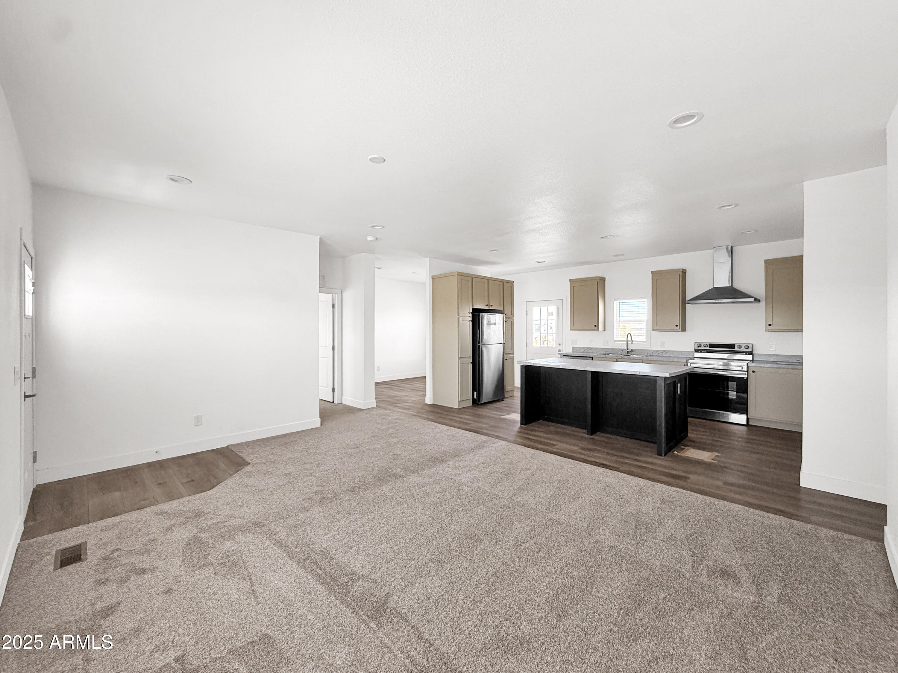 8548 North Page Road Florence, AZ 85132 - Photo 19 of 23 a large white kitchen with a sink and white cabinets