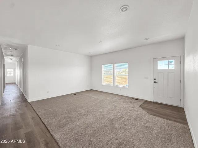a view of a kitchen with a sink and cabinets