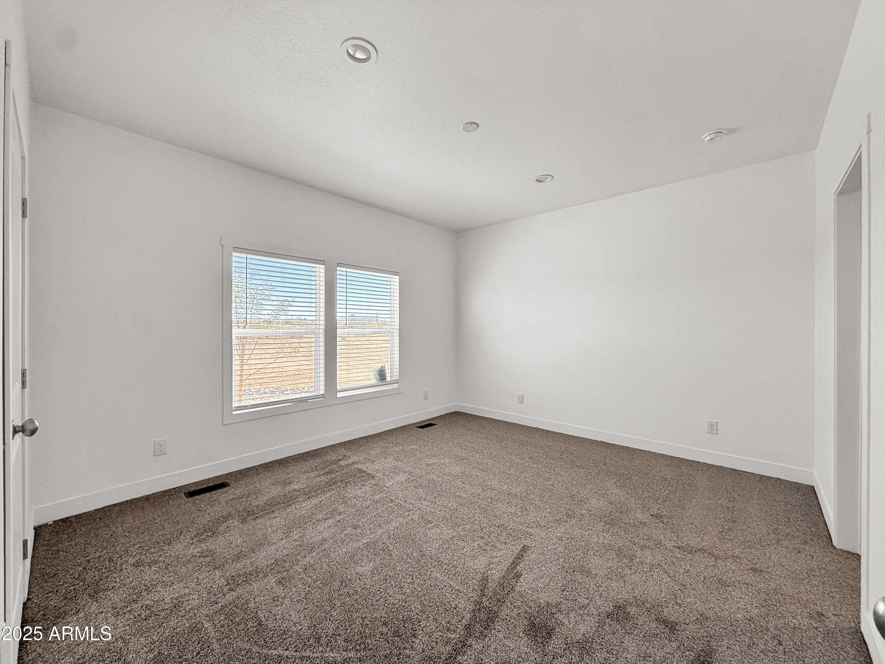 8548 North Page Road Florence, AZ 85132 - Photo 23 of 23 an empty room with a window